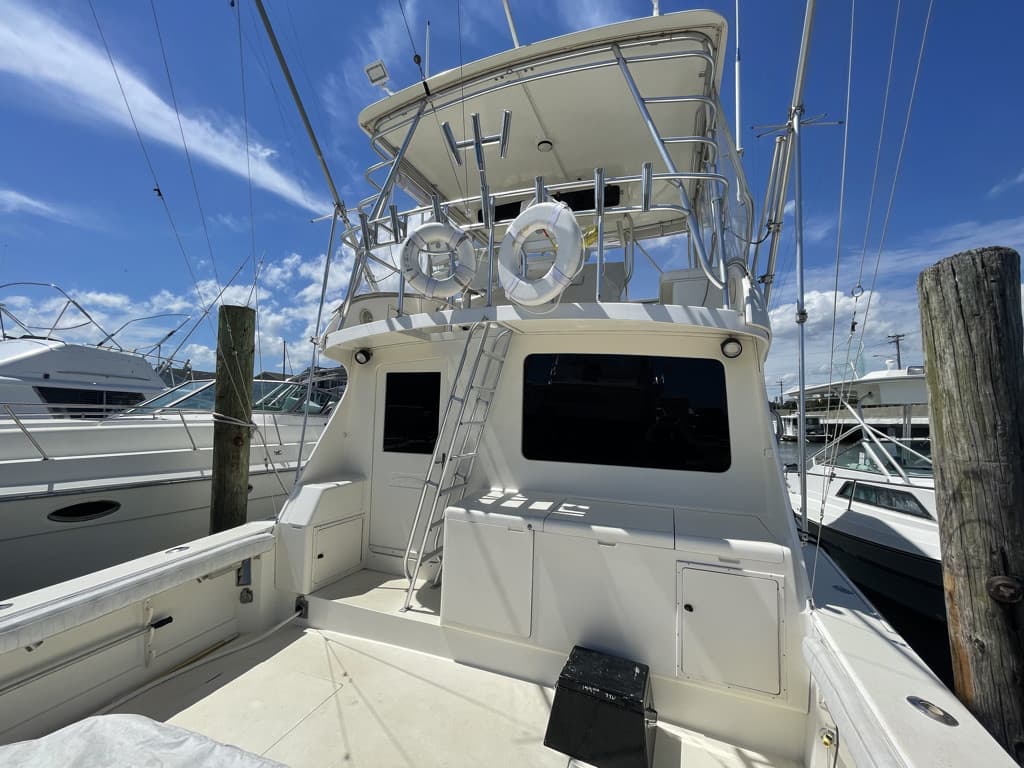 Sportfish cockpit and cabin windows in dark marine privacy film