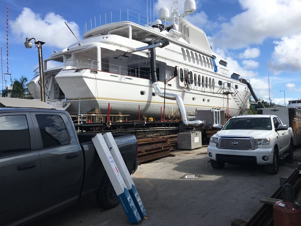 Motoryacht in a South Florida yard during a marine window film job