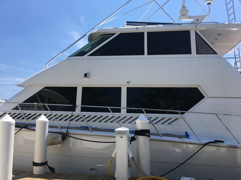 Sportfish cabin and flybridge windows with even dark tint