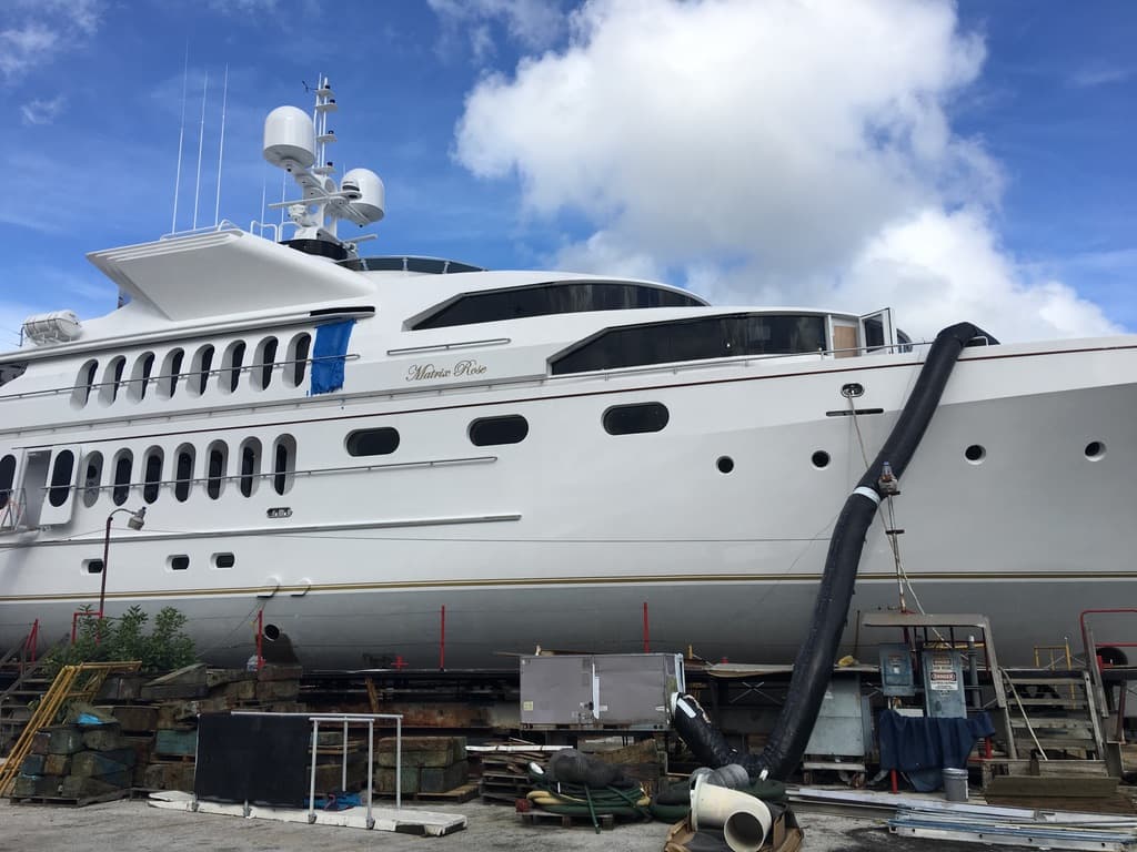 Large motoryacht on the hard with cabin windows ready for marine film