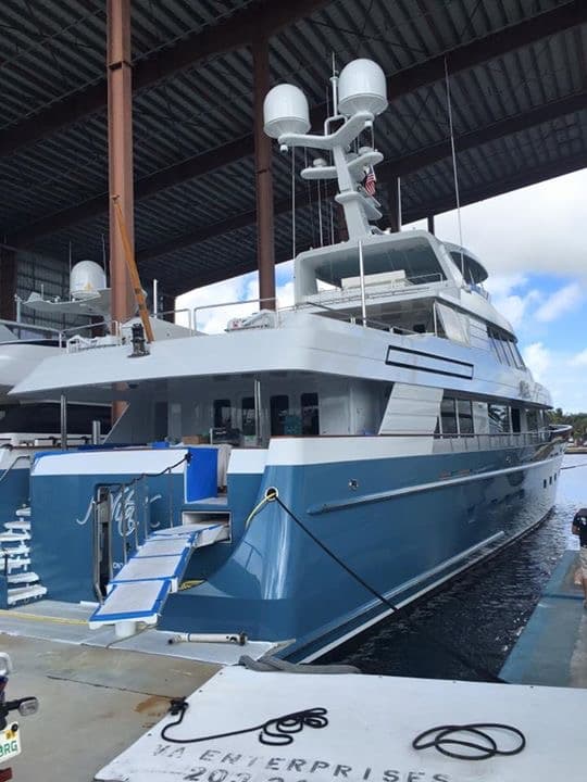 Blue-hull motoryacht in a covered shed after marine window film